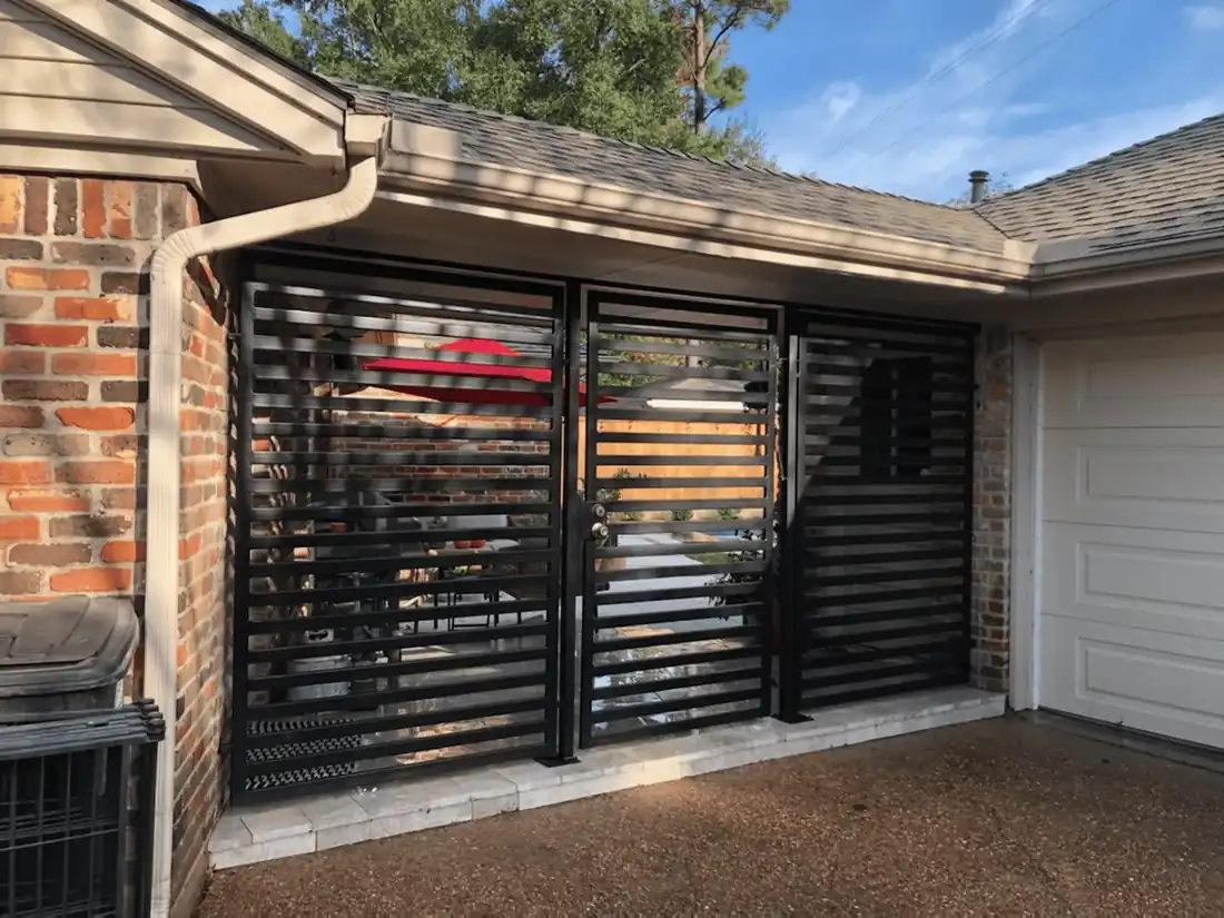 Horizontal iron driveway gate with access control by Griffin Fence