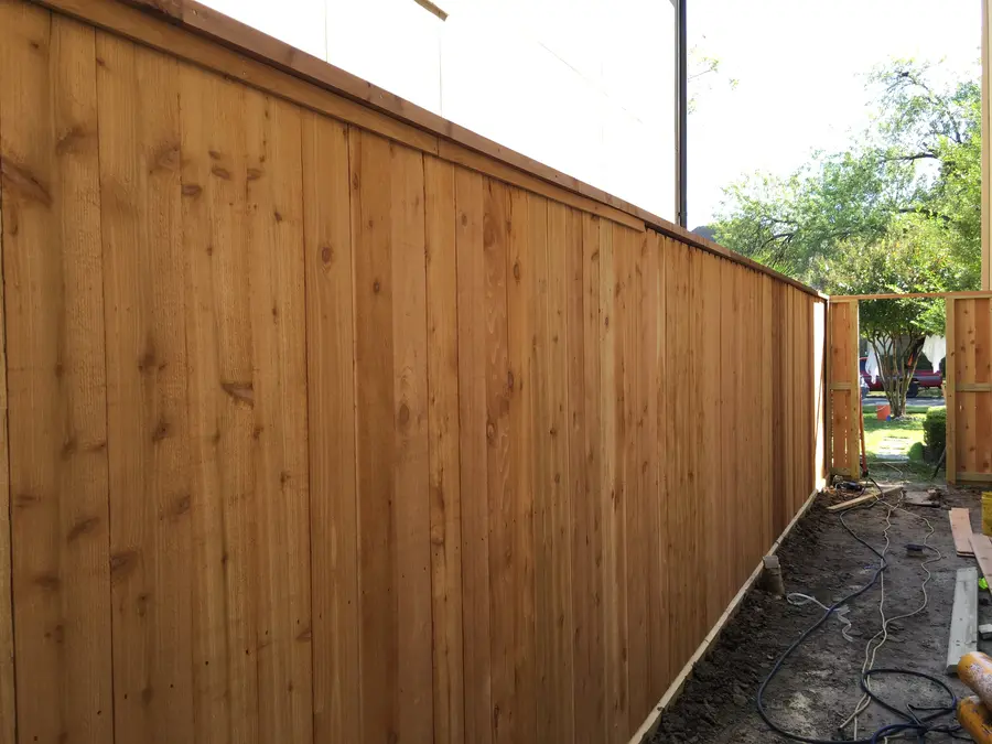 Cedar good neighbor fence with cap and baseboard installed by Griffin Fence Houston TX