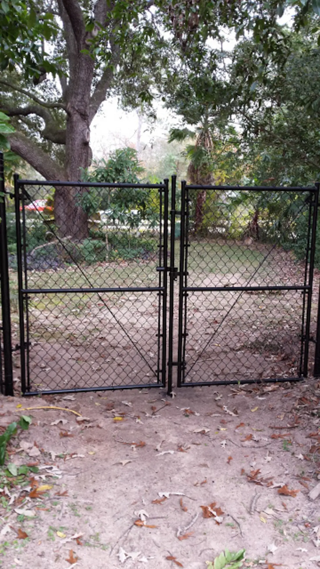 Black vinyl chain link fence installation Houston TX