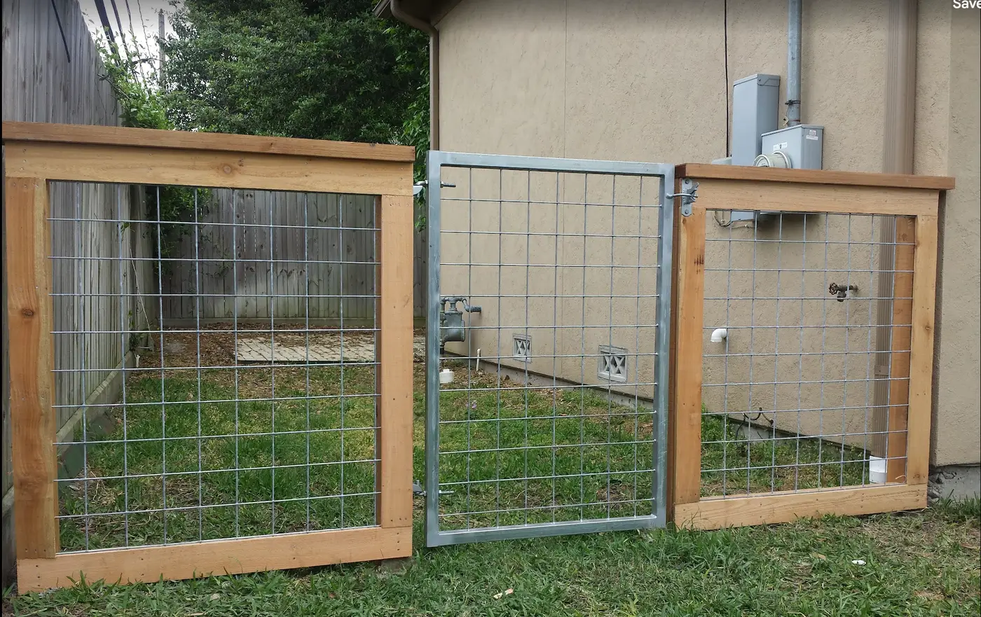 Wood-framed welded wire dog kennel enclosure with gate — Griffin Fence Houston, TX