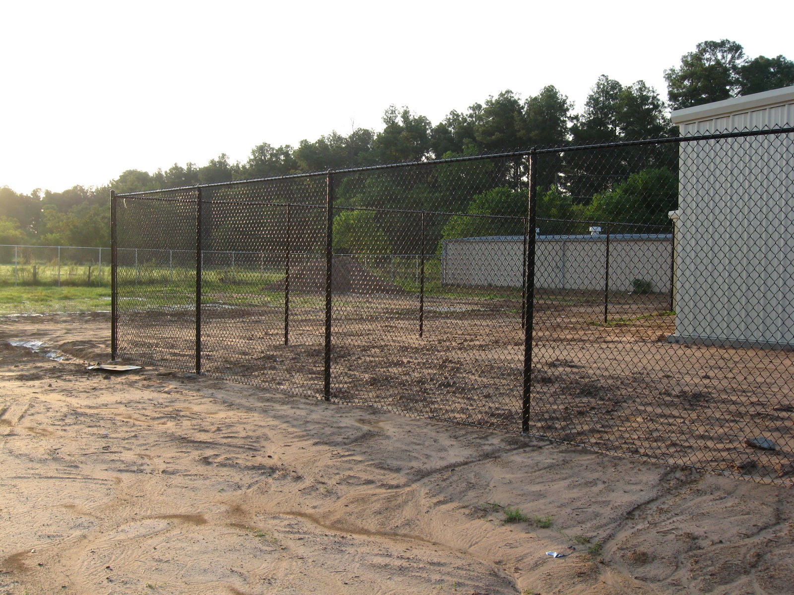 Black vinyl chain link fence installed in Houston TX by Griffin Fence